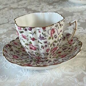 Vintage teacup.  Victoria.   One China, made in England.  All over rose pattern.